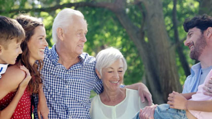 Happy family, with 3 generations, in the park